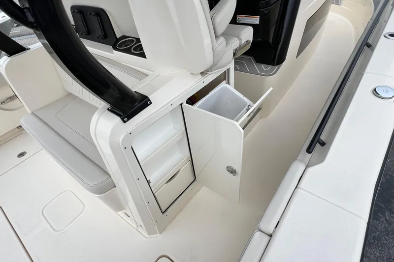 Slide: The Image of 2026 Scout 377 LXF boat interior with open storage compartment and seating. - 18