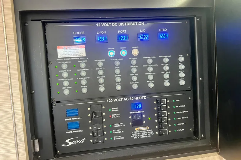 Slide: The Image of Control panel of a 2026 Scout 377 LXF boat, showing electrical distribution systems. - 19