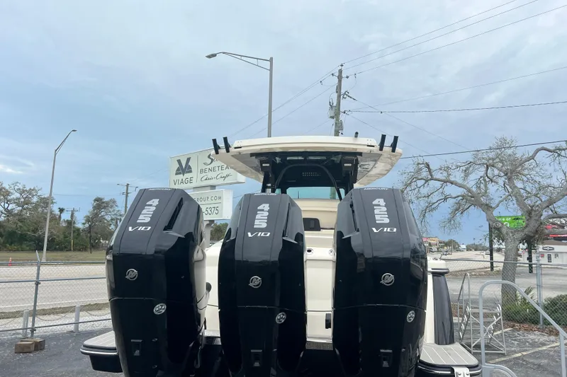 Slide: The Image of 2026 Scout 377 LXF boat with four powerful 425 V10 Mercury engines. - 2