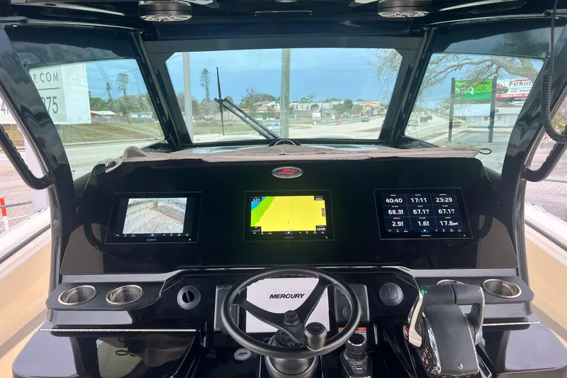 Slide: The Image of 2026 Scout 377 LXF boat dashboard with advanced navigation and control systems. - 8