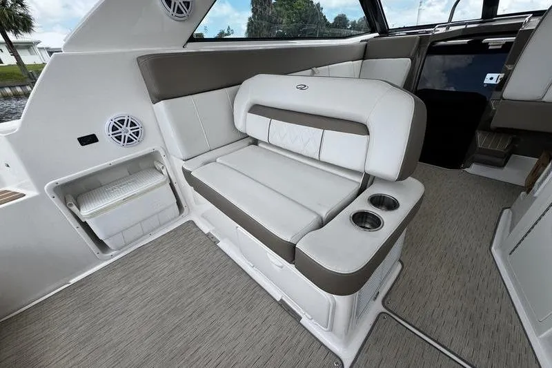 Slide: The Image of 2018 Regal 35 Sport Coupe interior with plush seating and integrated cup holders. - 14