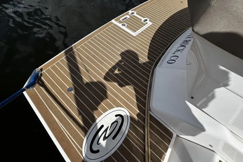 Slide: The Image of 2018 Regal 35 Sport Coupe boat deck with shadows and logo. - 17