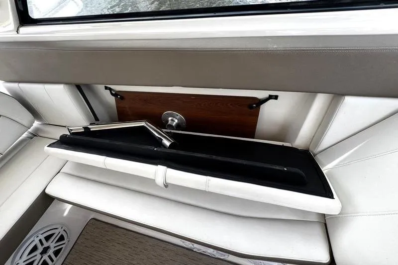 Slide: The Image of 2018 Regal 35 Sport Coupe interior with foldable seating and storage compartment. - 22