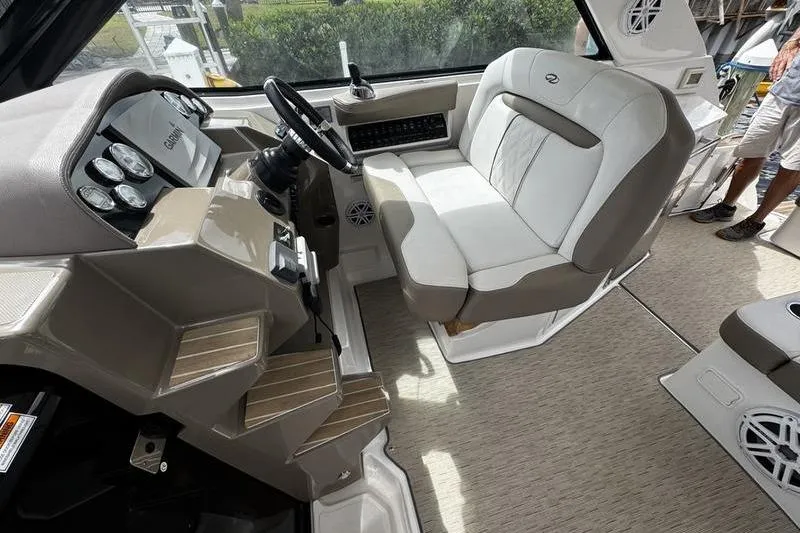 Slide: The Image of 2018 Regal 35 Sport Coupe helm with beige seating and modern dashboard controls. - 24