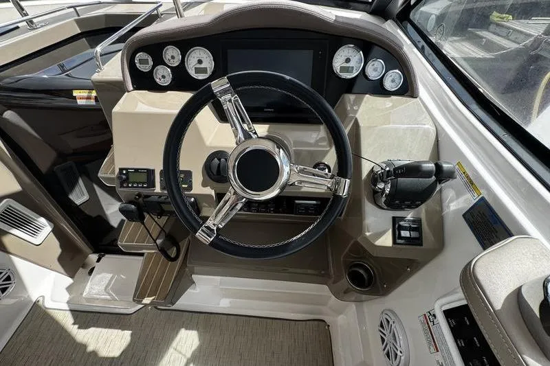 Slide: The Image of 2018 Regal 35 Sport Coupe helm with modern controls and steering wheel. - 25