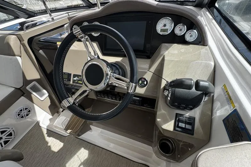 Slide: The Image of 2018 Regal 35 Sport Coupe dashboard with steering wheel and control panel. - 26