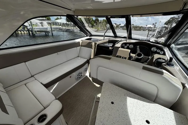 Slide: The Image of Interior of 2018 Regal 35 Sport Coupe yacht with luxurious seating and helm. - 30