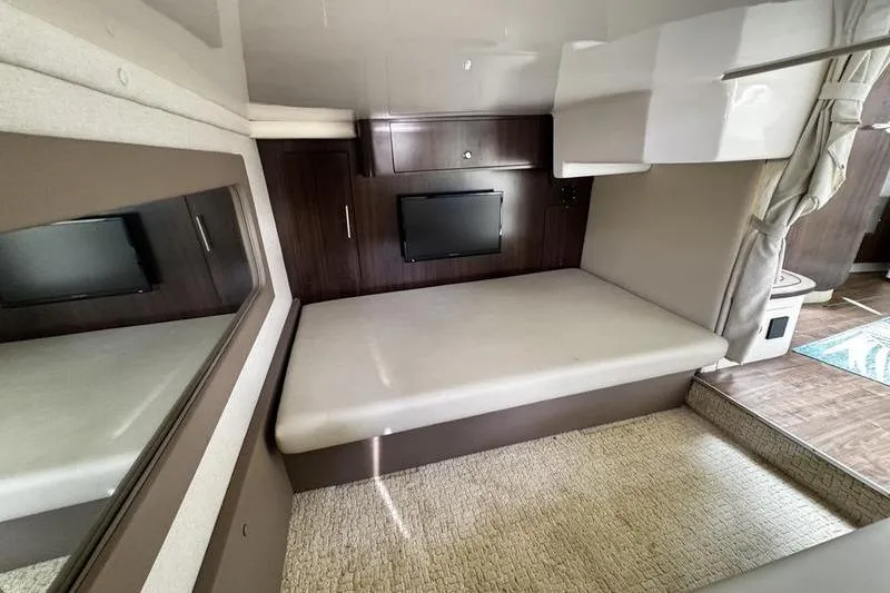 Slide: The Image of Interior of 2018 Regal 35 Sport Coupe with bed, TV, and modern design. - 39