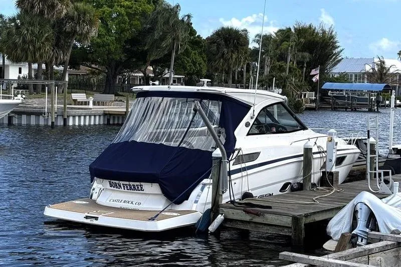 Slide: The Image of 2018 Regal 35 Sport Coupe docked by palm trees on a sunny day. - 4
