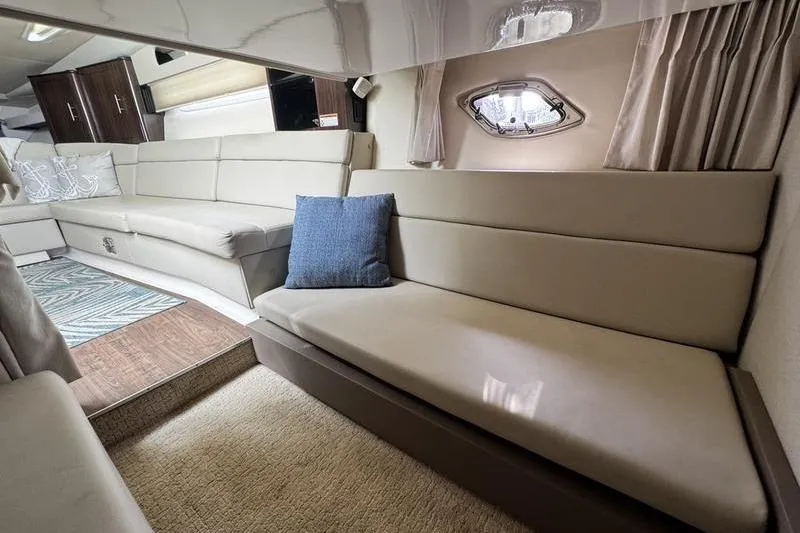 Slide: The Image of Luxurious interior of 2018 Regal 35 Sport Coupe with beige seating and modern decor. - 40