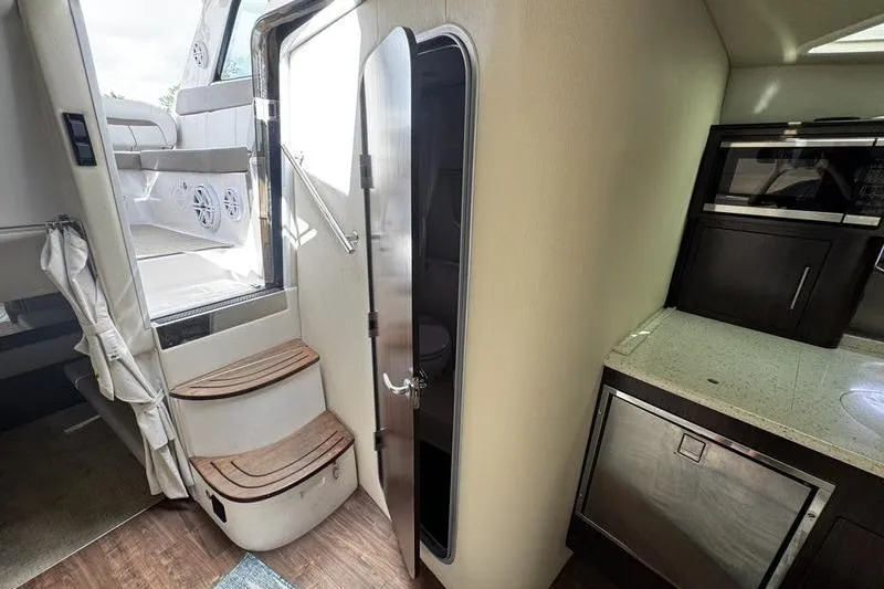 Slide: The Image of Interior of 2018 Regal 35 Sport Coupe with stairs and kitchenette. - 41