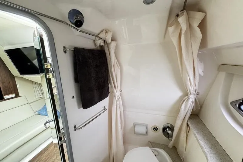 Slide: The Image of 2018 Regal 35 Sport Coupe bathroom with shower, towel, and modern amenities. - 43