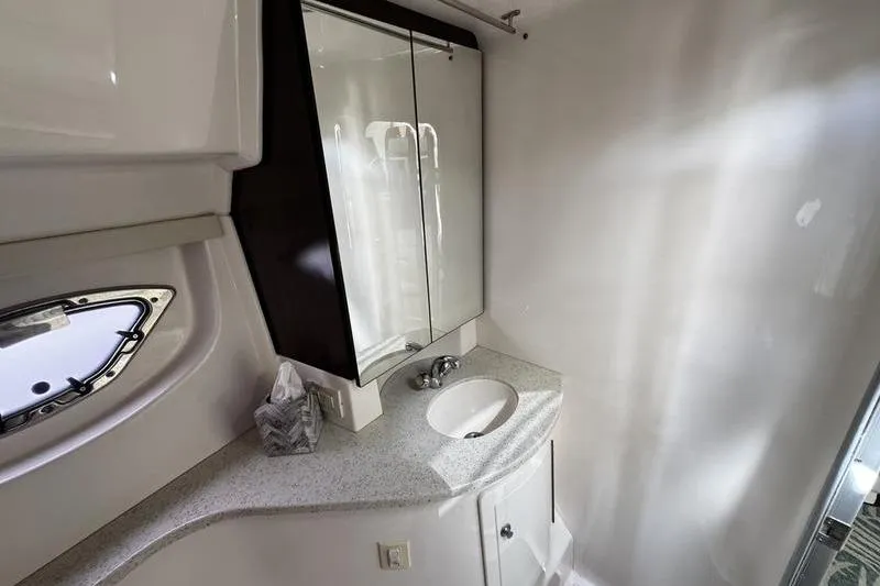 Slide: The Image of 2018 Regal 35 Sport Coupe bathroom with modern sink and mirrored cabinet. - 47