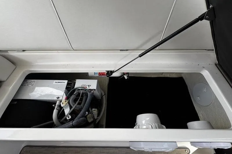 Slide: The Image of 2018 Regal 35 Sport Coupe engine compartment with battery and wiring. - 49