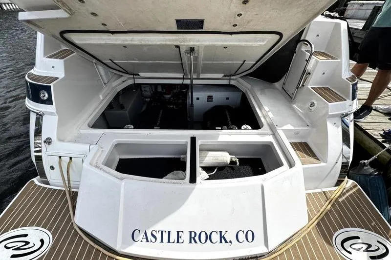 Slide: The Image of 2018 Regal 35 Sport Coupe boat engine compartment open, docked at Castle Rock, CO. - 6