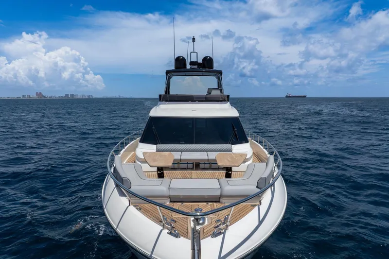 Slide: The Image of Luxurious 2022 Ferretti Yachts 670 cruising on open sea under blue skies. - 13