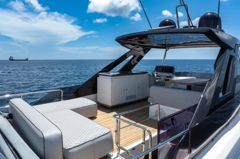Slide: The Image of Luxurious 2022 Ferretti Yachts 670 on open sea, featuring elegant deck and seating area. - 19