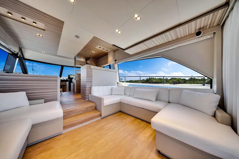 Slide: The Image of Luxurious interior of 2022 Ferretti Yachts 670 with modern seating and panoramic windows. - 27