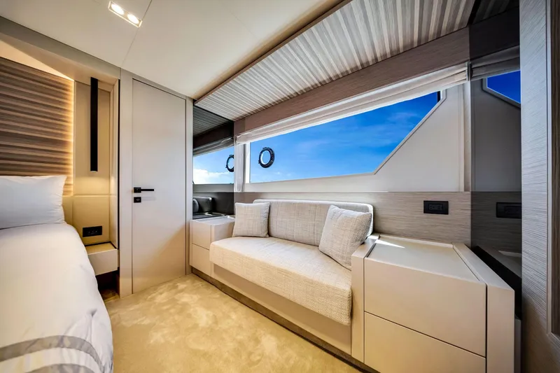 Slide: The Image of Luxurious interior of 2022 Ferretti Yachts 670, featuring elegant seating and panoramic windows. - 43