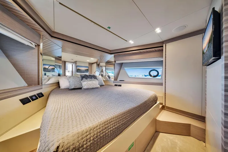 Slide: The Image of Luxurious bedroom interior of 2022 Ferretti Yachts 670 with modern design and elegant furnishings. - 49
