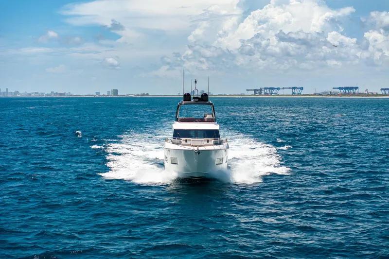 Slide: The Image of 2022 Ferretti Yachts 670 cruising on open sea under clear skies. - 70