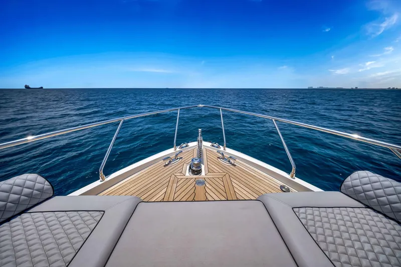 Slide: The Image of Ferretti Yachts 670, 2022 model, cruising on open sea with clear blue skies. - 8