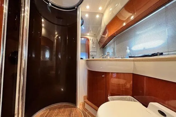 Slide: The Image of Luxurious bathroom interior of 2003 Viking Princess 50 Sport Cruiser yacht. - 14