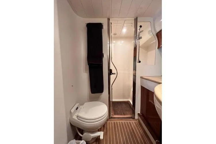 Slide: The Image of Bathroom interior of 2003 Viking Princess 50 Sport Cruiser with shower and toilet. - 22