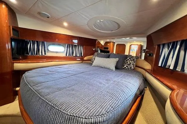 Slide: The Image of Luxurious cabin interior of 2003 Viking Princess 50 Sport Cruiser with cozy bedding. - 24