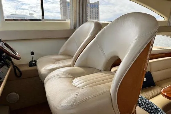 Slide: The Image of Luxurious interior of 2003 Viking Princess 50 Sport Cruiser with plush leather seating. - 35