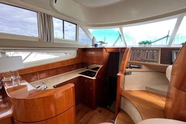 Slide: The Image of Interior of 2003 Viking Princess 50 Sport Cruiser with elegant wood finish and modern amenities. - 39