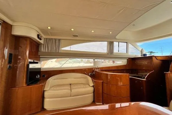 Slide: The Image of Luxurious interior of 2003 Viking Princess 50 Sport Cruiser with elegant wood finish. - 44