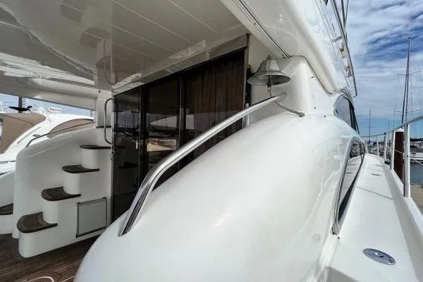 Slide: The Image of 2003 Viking Princess 50 Sport Cruiser yacht, sleek design, docked at marina. - 45