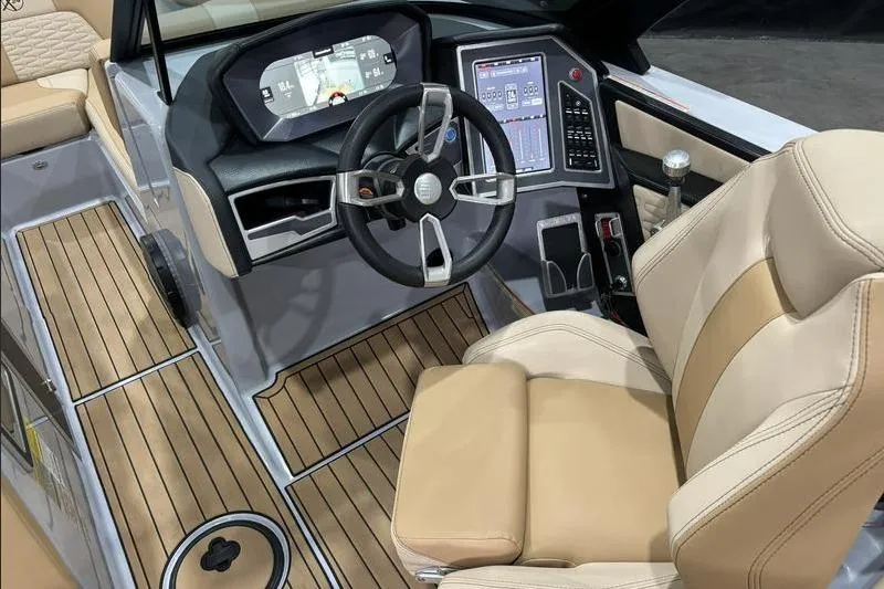 Slide: The Image of 2024 MasterCraft X24 boat cockpit with modern controls and luxurious seating. - 10