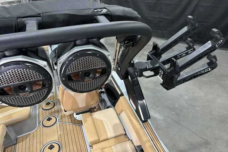 Slide: The Image of 2024 MasterCraft X24 boat interior with speakers and wakeboard rack. - 13