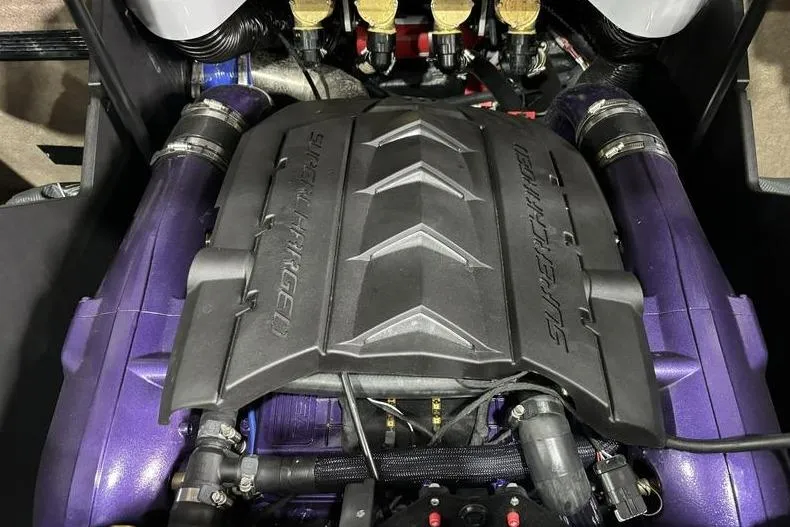 Slide: The Image of 2024 MasterCraft X24 engine with supercharged cover, featuring purple components. - 14