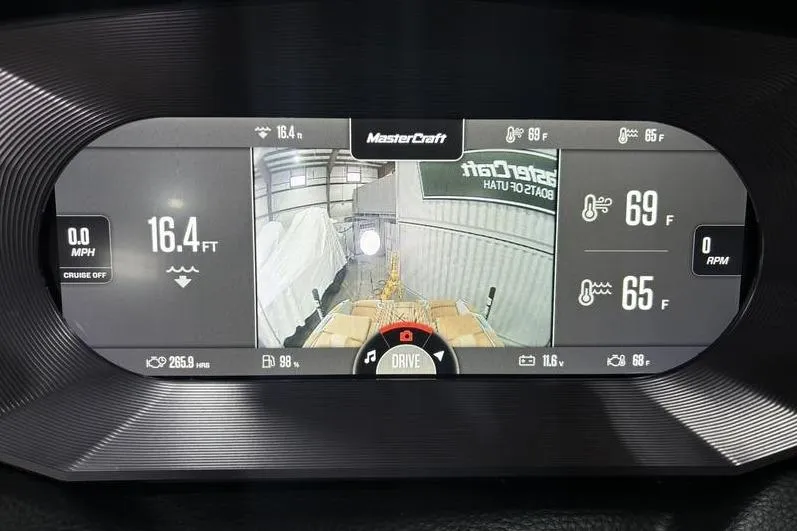 Slide: The Image of 2024 MasterCraft X24 dashboard display showing navigation and temperature settings. - 15