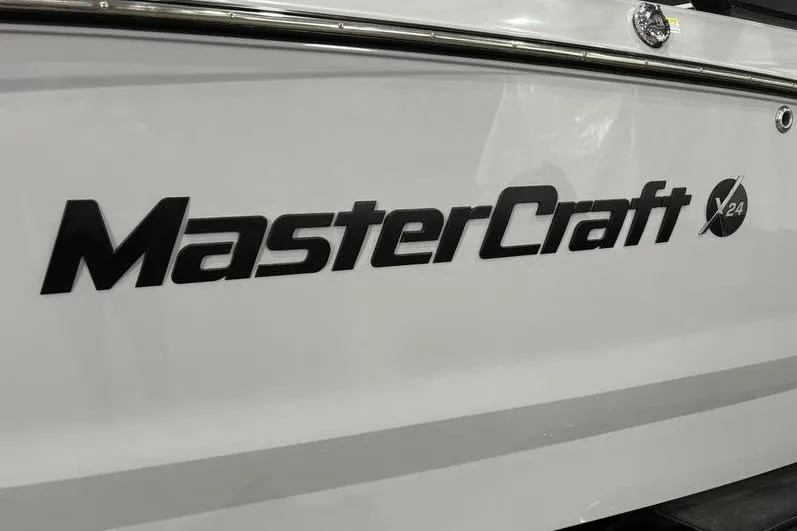 Slide: The Image of 2024 MasterCraft X24 boat logo on white hull. - 3