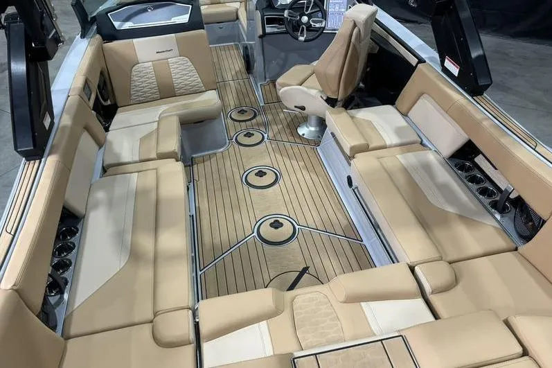 Slide: The Image of 2024 MasterCraft X24 interior with luxurious tan seating and sleek design. - 6