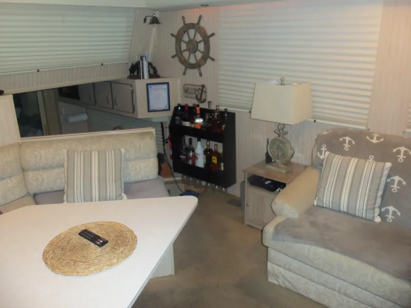 Slide: The Image of Cozy 2003 Gibson Classic boat interior with nautical decor and comfortable seating. - 28