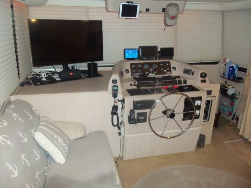 Slide: The Image of Control room of a 2003 Gibson Classic boat with steering wheel and electronics. - 30