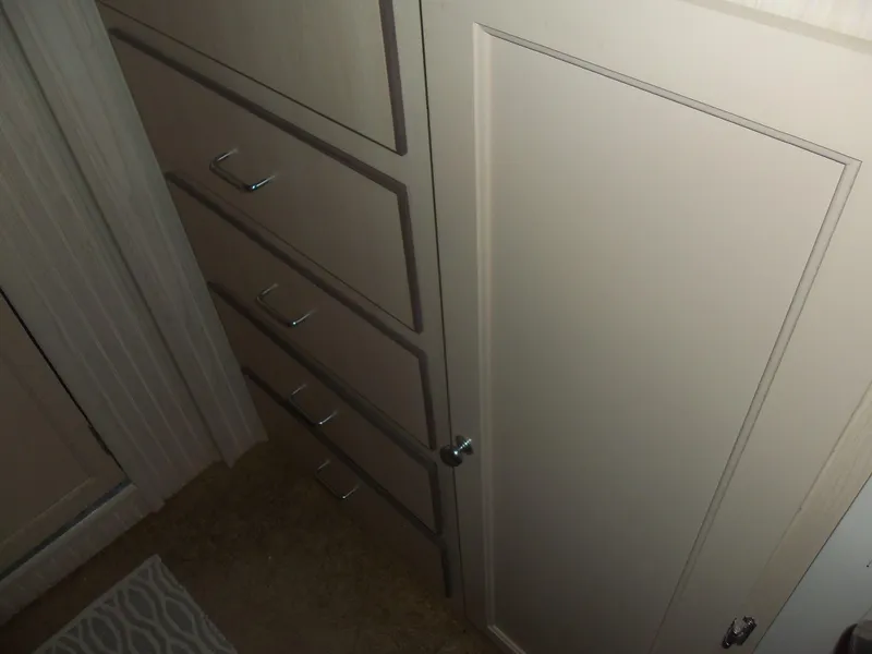 Slide: The Image of Cabinet with drawers and door in a Gibson Classic 2003 model interior. - 45