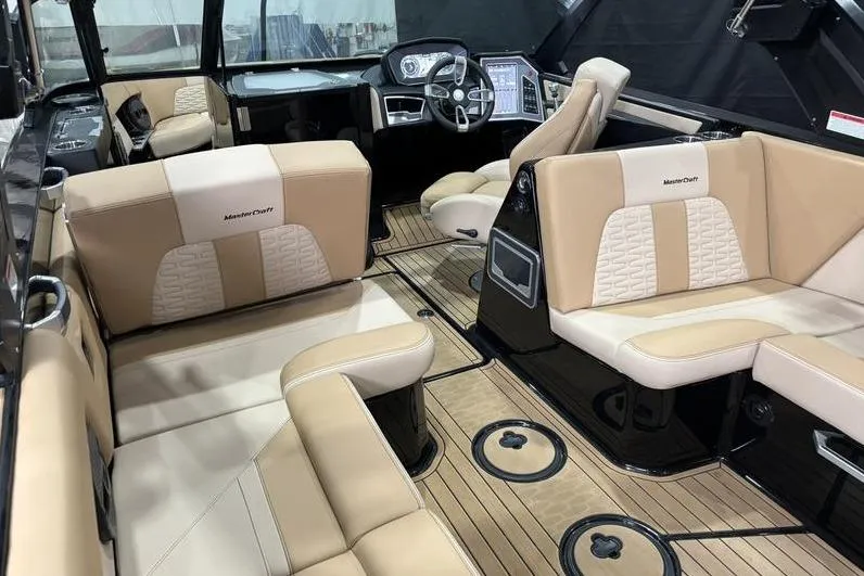 Slide: The Image of 2024 MasterCraft X26 interior with luxurious seating and modern dashboard design. - 10