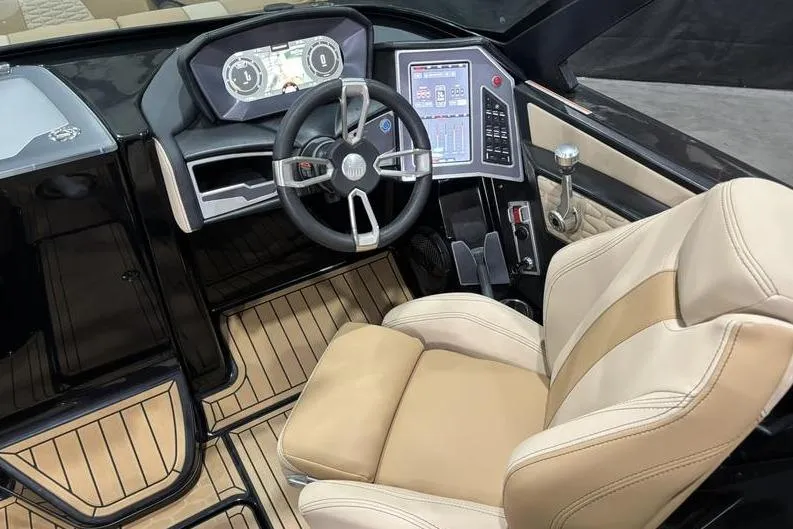 Slide: The Image of 2024 MasterCraft X26 boat cockpit with modern steering and digital controls. - 13