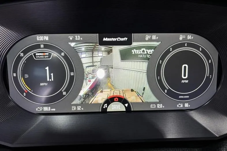Slide: The Image of 2024 MasterCraft X26 dashboard display showing speed, RPM, and rear camera view. - 14