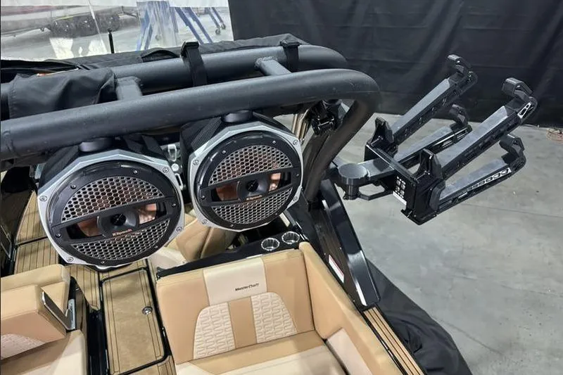 Slide: The Image of 2024 MasterCraft X26 boat interior with speakers and wakeboard rack. - 18