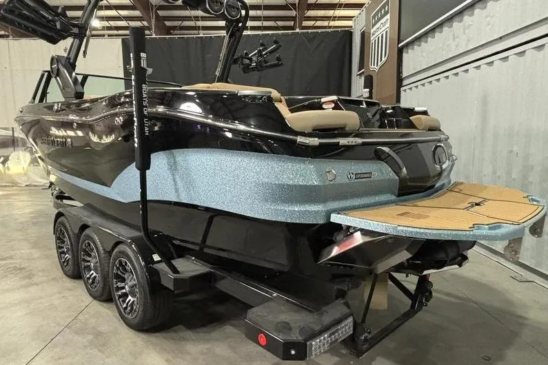 Slide: The Image of 2024 MasterCraft X26 boat on trailer in indoor showroom. - 4