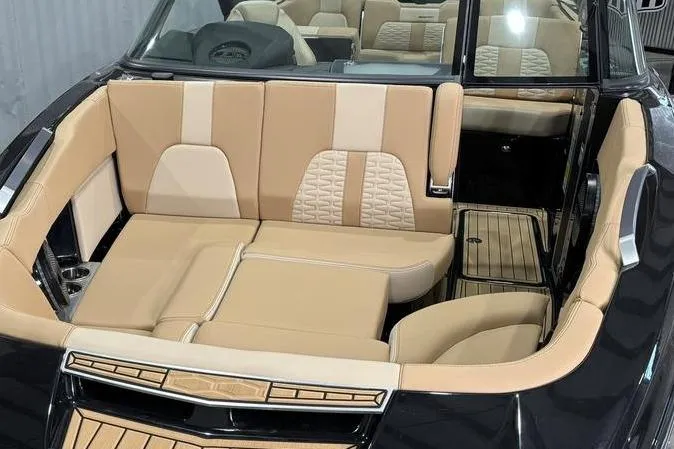 Slide: The Image of 2024 MasterCraft X26 boat interior with luxurious beige seating and modern design. - 5