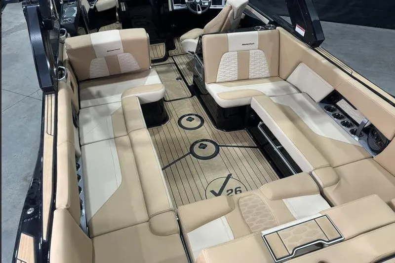 Slide: The Image of Luxurious interior of 2024 MasterCraft X26 boat with beige seating and sleek design. - 8