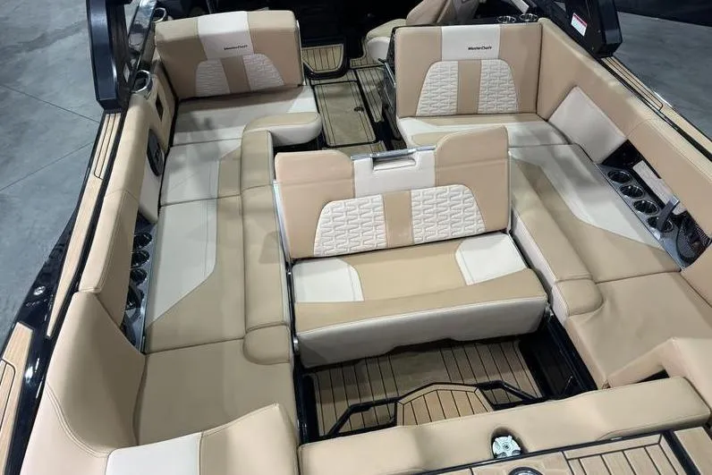 Slide: The Image of 2024 MasterCraft X26 interior with beige seating and modern design. - 9